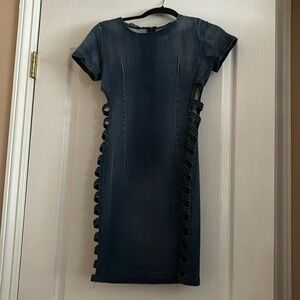 Size medium blue jean dress never worn cut outs on the side zips in the back